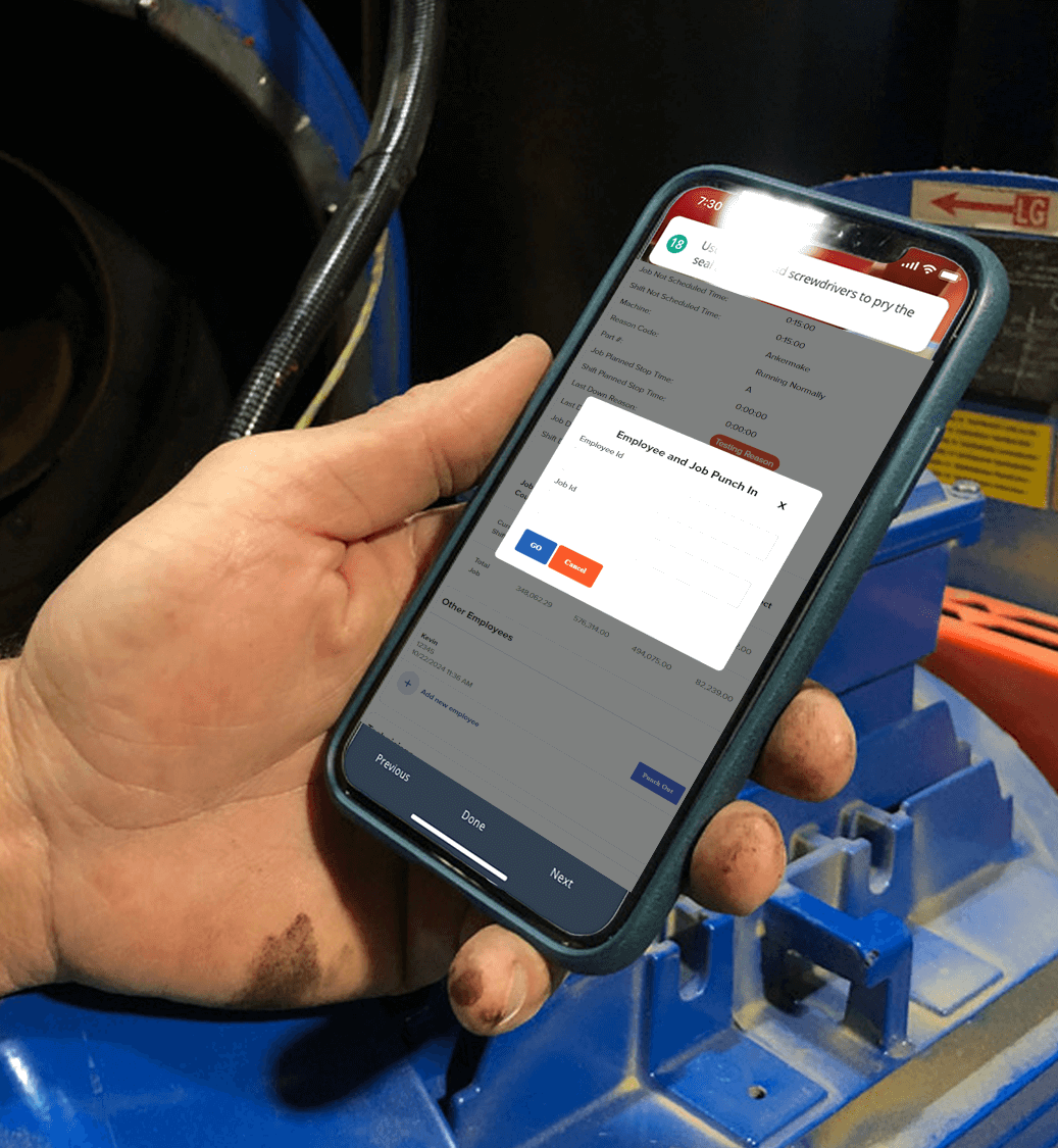 Phone showing the OEE Work Tracker dashboard with an operator punching into a job